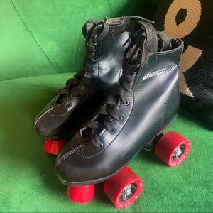 Roller skates. Black. Kids size one. Red wheels.